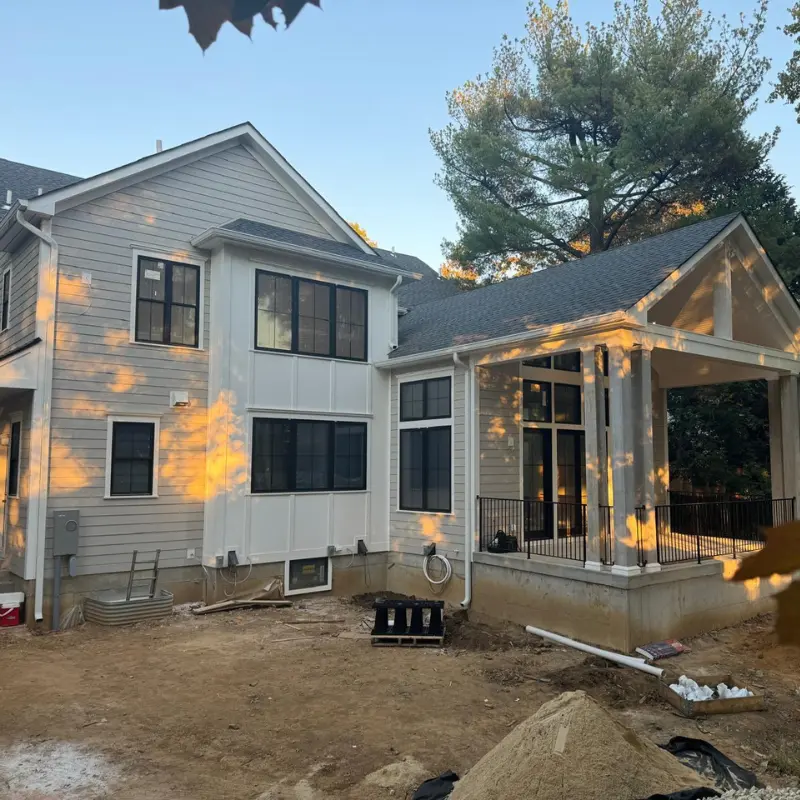 Completed home addition with finished siding and covered porch